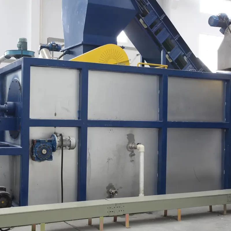 a hot washer system, an essential component in a plastic recycling line designed to clean plastic flakes or granules. This system typically uses hot water and detergents or other cleaning agents to remove contaminants such as oils, glues, and labels from plastic materials. The process ensures that the plastic is sufficiently purified for high-quality recycling.