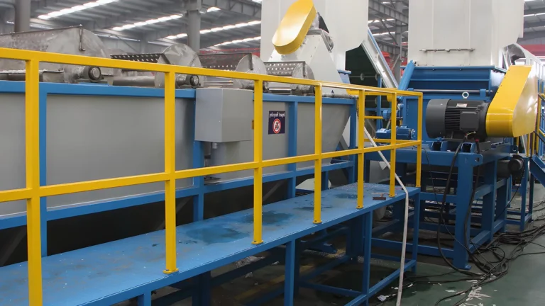 Industrial machinery with safety railing in a factory.